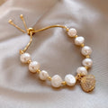 Adjustable Gold-Tone Baroque Pearl Bracelet with Pavé Heart