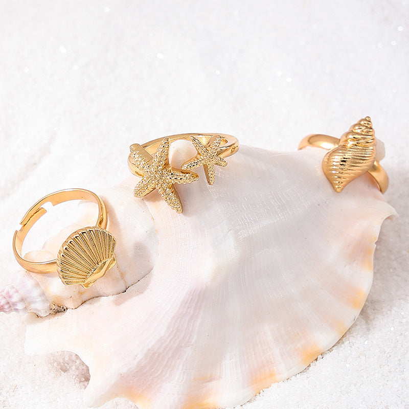 Gold Tone Ocean Shell and Starfish Rings