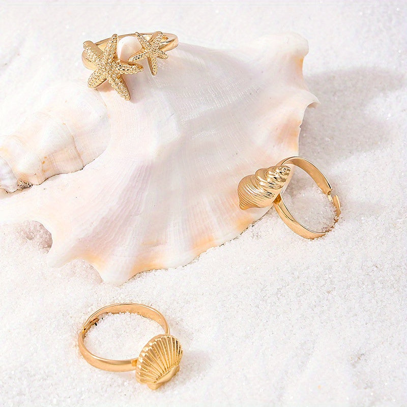 Gold Tone Ocean Shell and Starfish Rings