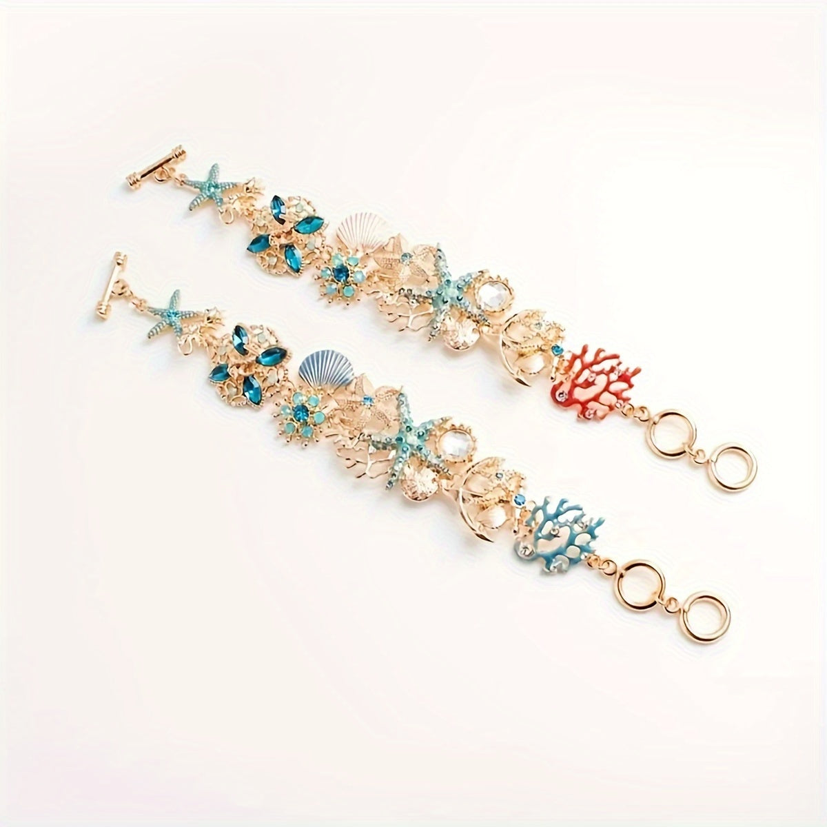 Gold Tone Sea Life Bracelet with Starfish & Blue Gems