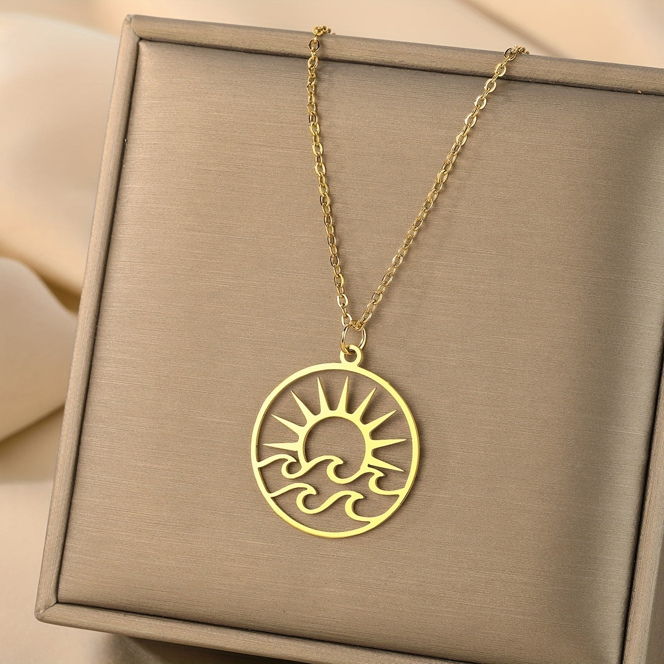 Gold-Tone Sun and Waves Pendant Necklace