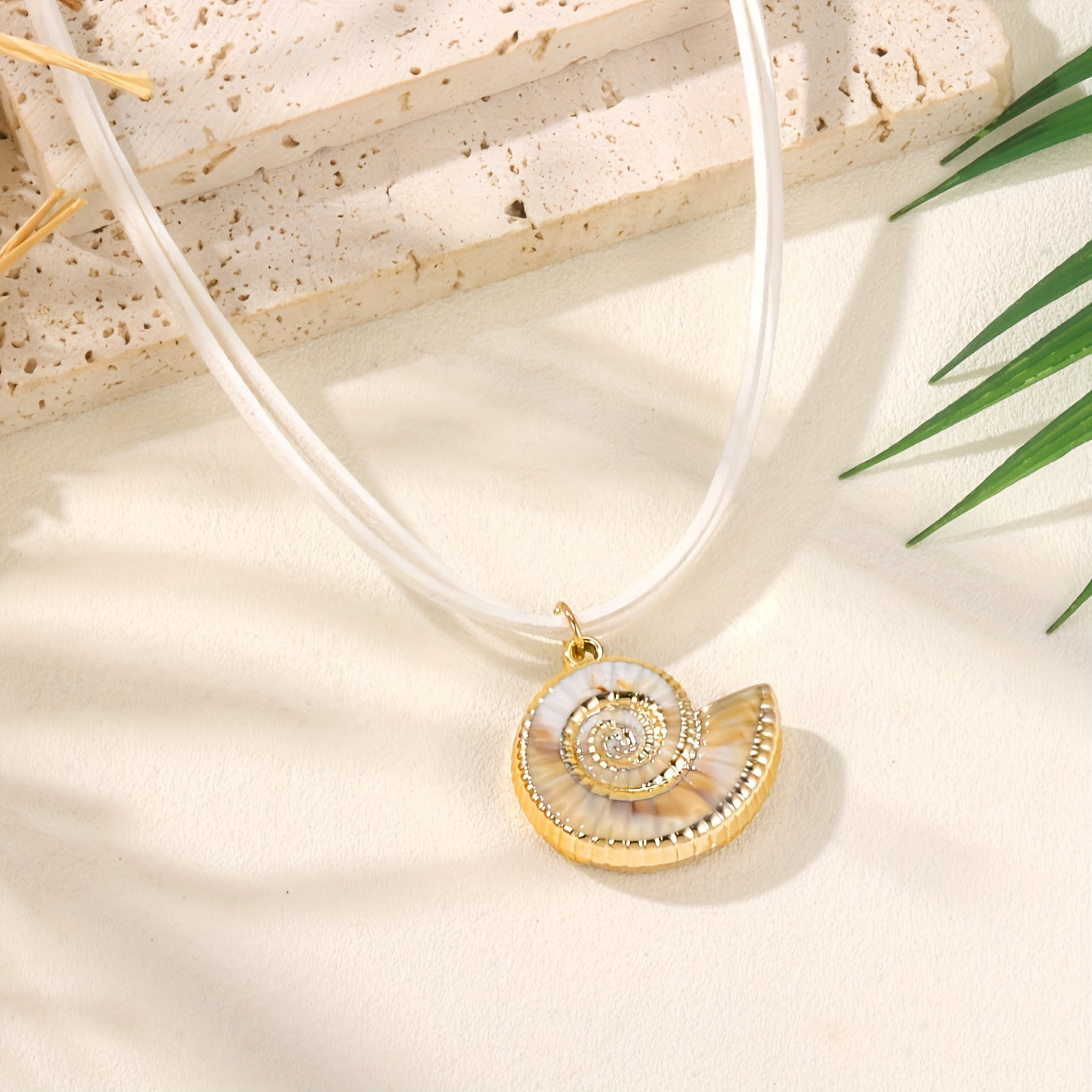 Gold Nautilus Shell Necklace on White Cord
