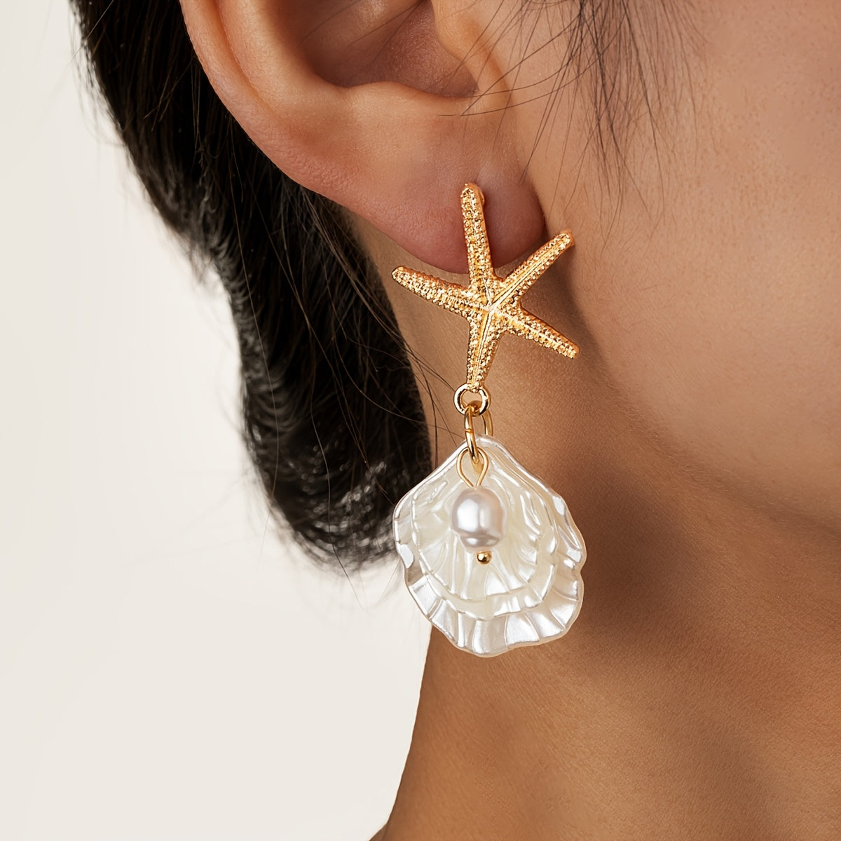 Gold Starfish Drop Earrings with Iridescent Seashell
