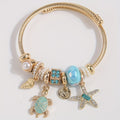 Gold-Tone Sea Charm Bangle Bracelet with Pearls