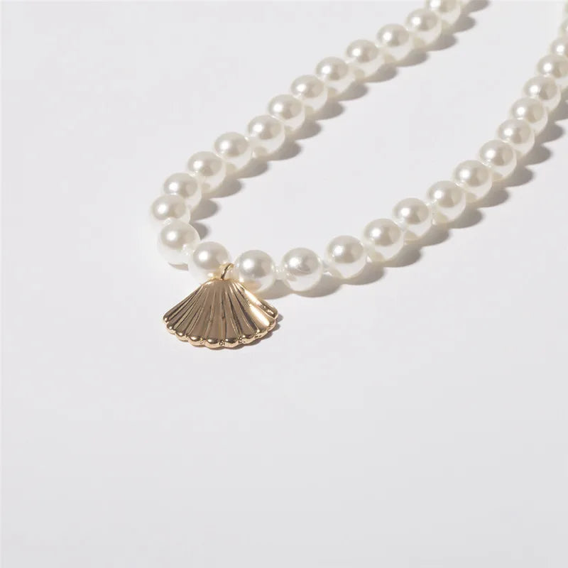 Pearl Necklace with Gold Shell Pendant