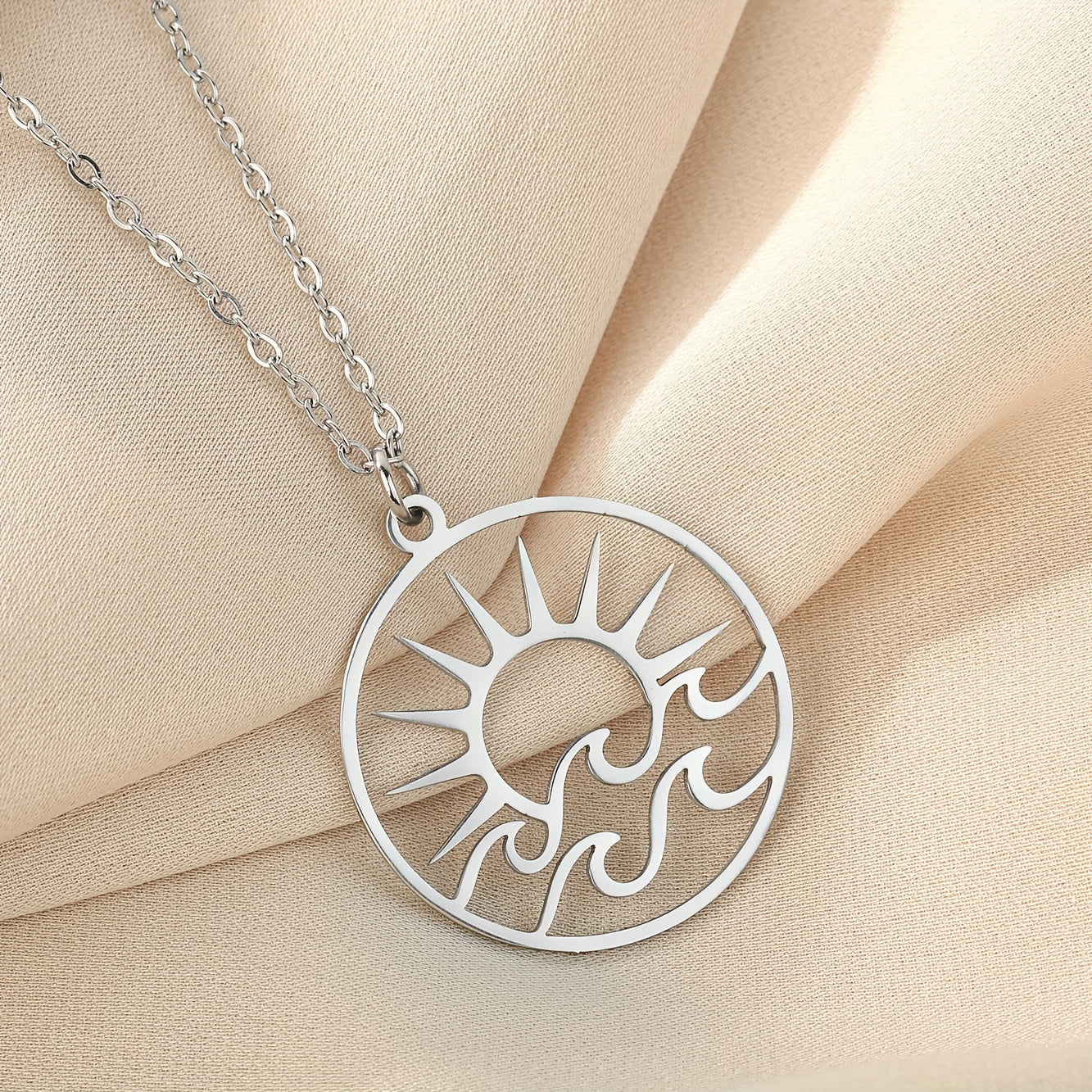 Gold-Tone Sun and Waves Pendant Necklace