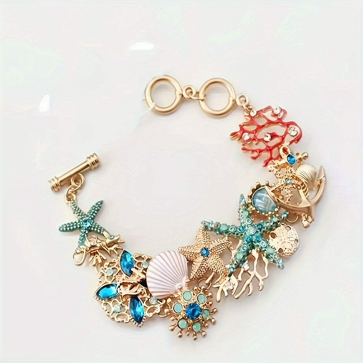 Gold Tone Sea Life Bracelet with Starfish & Blue Gems