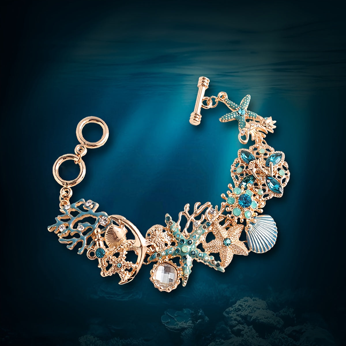 Gold Tone Sea Life Bracelet with Starfish & Blue Gems