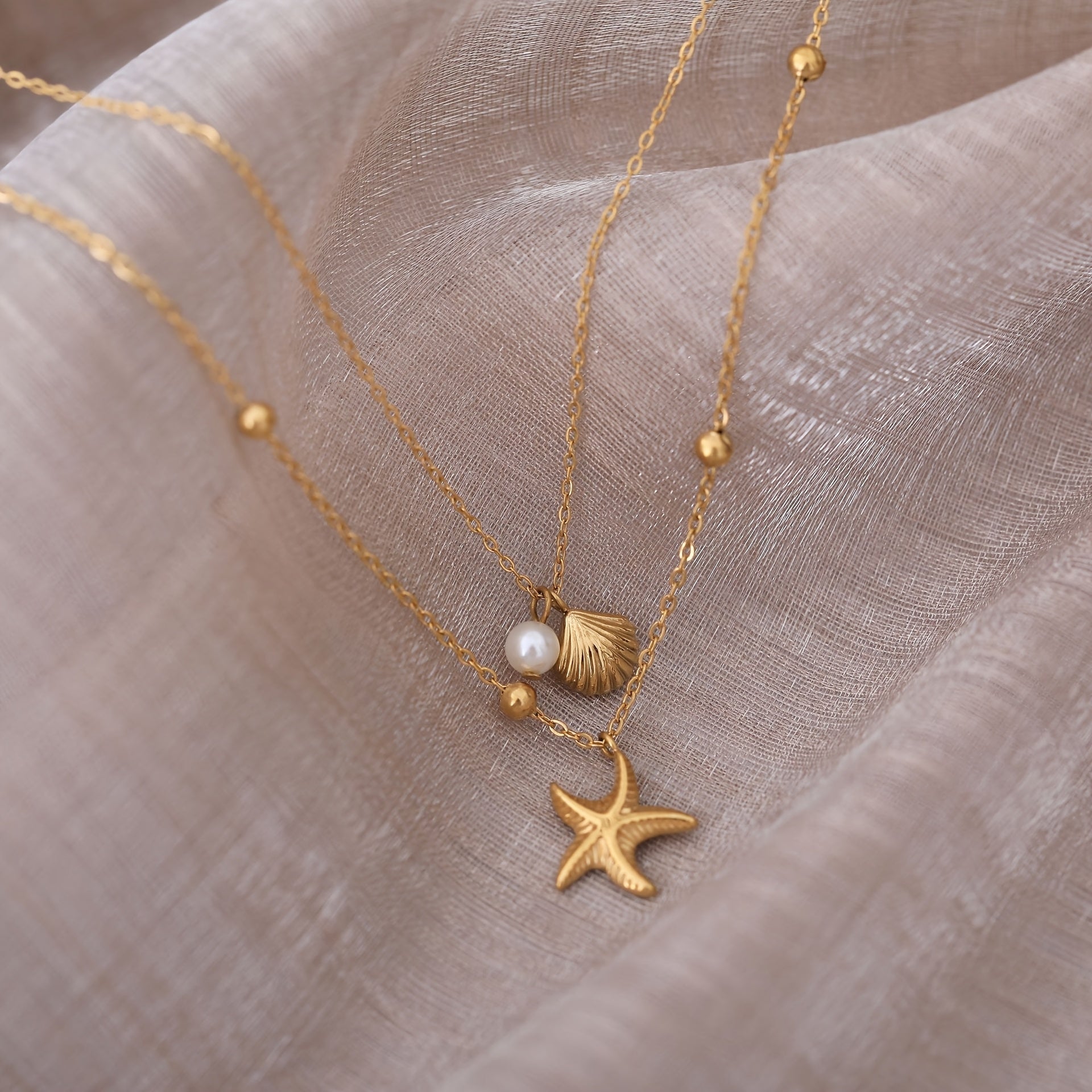 Layered Gold Necklace with Pearl, Seashell & Starfish