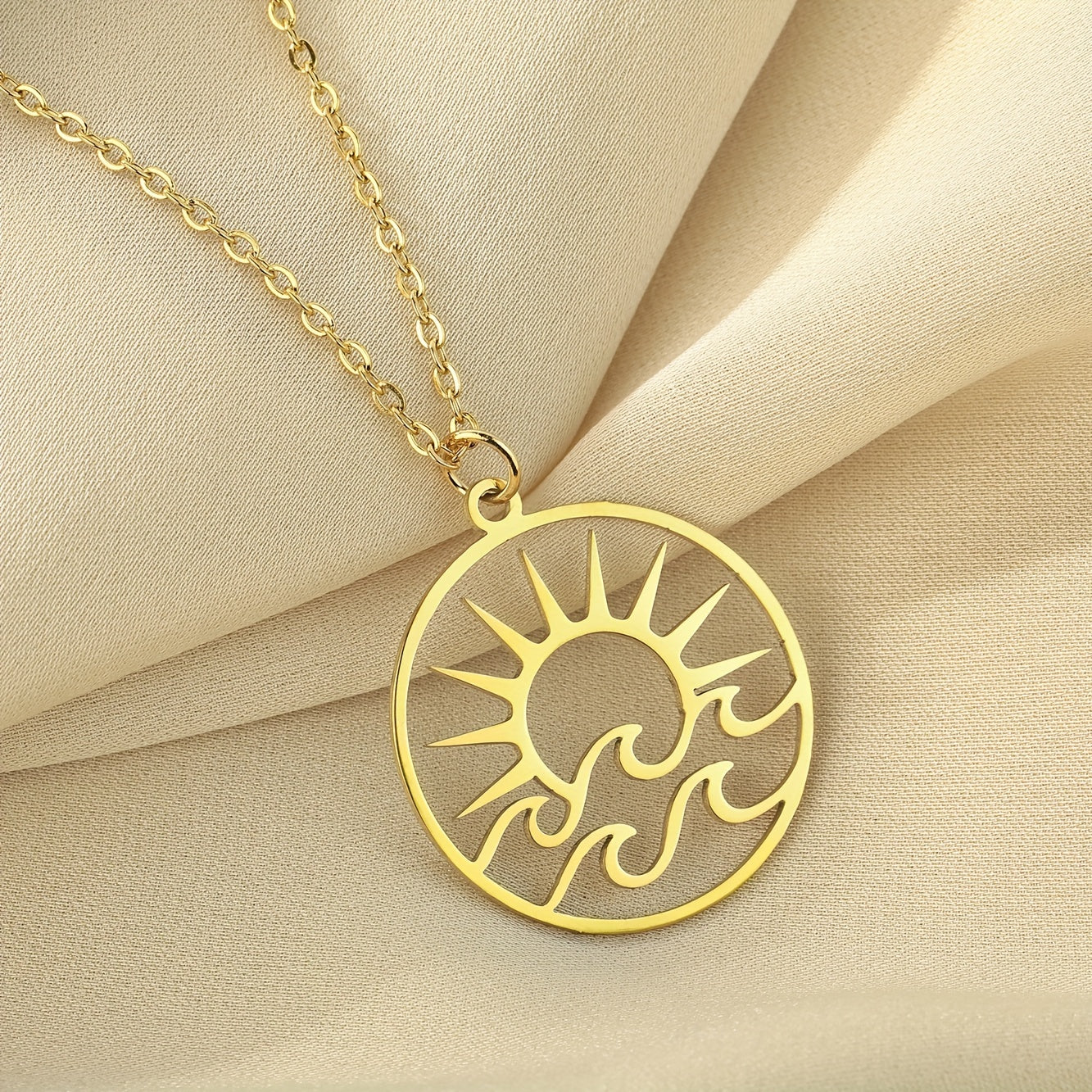 Gold-Tone Sun and Waves Pendant Necklace
